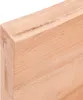 Close-up of a light-colored wooden surface with visible grain. Náhľad obrázku produktu