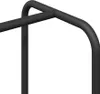 A close-up view of a black metal clothing rack with a shelf. Náhled obrázku produktu