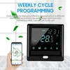 A hand holding a smartphone displaying a smart thermostat app next to a smart thermostat device. Náhled obrázku produktu
