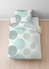 A bedding set with a polka dot pattern is laid out on a bed. Produktbild-Vorschau