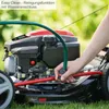 A person is connecting a hose to a lawnmower for cleaning. Produktbild-Vorschau