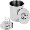 A stainless steel ham cooker with its lid and a spring-loaded base. Produktbild-Vorschau