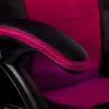 A close-up shot of the armrest of a chair, showing the black padding with pink stitching and the pink fabric of the chair's backrest. Produktbild-Vorschau