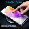 A hand is shown touching a smartphone that is placed on a wireless charger. The phone has a colorful abstract wallpaper. Produktbild-Vorschau