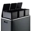 A close-up, studio shot of a multi-compartment trash can. Voir les images du produit