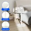 A white side table with a laptop and coffee cup on it, placed next to a bed. Anteprima dell’immagine prodotto
