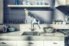 A modern kitchen counter with a sink, faucet, toaster, and decorative items. Produktbild-Vorschau