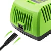 A close-up view of a green battery charger with a black power cord plug being inserted. Produktbild-Vorschau