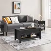 A living room scene featuring a grey sofa, a black coffee table, and a side table. Produktbild-Vorschau