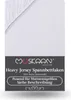 A white fitted sheet with a branded label. Produktbild-Vorschau