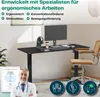 A desk setup with a standing desk, computer, chair, and a doctor in the foreground. Produktbild-Vorschau