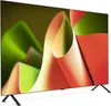 A television screen displaying abstract colorful shapes. Produktbild-Vorschau