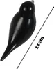 A black bird figurine with a measurement line indicating its size. Voir les images du produit