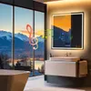 A modern bathroom with a large window overlooking a snowy mountain landscape at sunset. A lighted mirror with a digital display is mounted above a sink and vanity. Musical notes and a treble clef are overlaid on the image. Anteprima dell’immagine prodotto