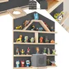 A wall shelf filled with various small toys and figurines. Produktbild-Vorschau