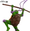 A statue of Donatello from Teenage Mutant Ninja Turtles holding his bo staff. Podgląd zdjęcia produktu