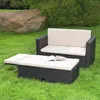 Outdoor furniture set on a grassy lawn with a large rock and trees in the background. Podgląd zdjęcia produktu
