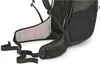 A close-up view of the lower back and hip belt of a black backpack. Produktbild-Vorschau