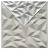 A square panel with a geometric, faceted design, partially covered by another panel of the same design but with a lighter, more reflective surface. Produktbild-Vorschau