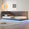 A modern upholstered bed with integrated LED lighting and USB ports, set in a bedroom environment. Produktbild-Vorschau