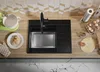 A kitchen counter with a sink, mixer, cookies, and baking ingredients. Produktbild-Vorschau