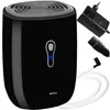 A black dehumidifier with its accessories, including a power adapter and a drainage hose, is displayed against a white background. Náhled obrázku produktu