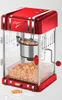 A red and silver retro-style popcorn maker with popcorn inside. Náhled obrázku produktu