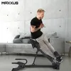 A man is using a fitness machine in a living room setting. Produktbild-Vorschau