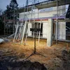 Construction site with scaffolding and a portable work light. Produktbild-Vorschau