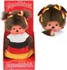 A Monchhichi doll dressed in a German flag-themed outfit, displayed in its packaging and as a close-up. Náhled obrázku produktu