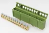 A brass terminal block with multiple screw terminals and a green plastic housing for a DIN rail are shown on a white background. Produktbild-Vorschau