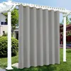 Outdoor curtains hanging from a pergola in a garden setting. Náhled obrázku produktu