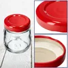 A collage of images showing a glass jar with a red lid, a close-up of the lid, and a close-up of the jar's rim. Podgląd zdjęcia produktu