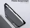 A close-up view of a transparent phone case, showing precise cutouts for ports and speakers. The phone inside the case is dark gray. Produktbild-Vorschau