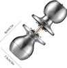 A close-up, angled view of a disassembled silver doorknob set, with measurement indicators. Podgląd zdjęcia produktu