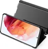 A black flip case for a smartphone is shown open, displaying the phone's screen with a colorful abstract image. Produktbild-Vorschau