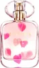 A bottle of Escada Celebrate N.O.W. Eau de Parfum for women, with pink petals floating around it. Produktbild-Vorschau