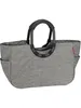 A studio shot of a gray shopping bag with black handles against a white background. Podgląd zdjęcia produktu