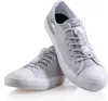 A pair of gray sneakers with white soles and white elastic shoelaces with quick-release fasteners. Produktbild-Vorschau