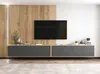 A modern TV console with a large television mounted above it, set against a wooden paneled wall. Produktbild-Vorschau