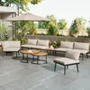 An outdoor patio set with a sofa, chairs, coffee tables, and an umbrella. Produktbild-Vorschau
