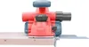 A red and blue electric planer is shown resting on a wooden plank, with a white background. Náhľad obrázku produktu