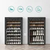 Two black shoe racks are shown side by side, with a comparison graphic in between. The rack on the left is filled with various shoes, while the rack on the right shows how boots can be stored, implying a modular or adjustable design. Produktbild-Vorschau