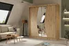A bedroom or living room setting with a wardrobe, sofa, coffee table, and floor lamp. Produktbild-Vorschau