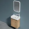 A modern bathroom vanity with a sink and faucet against a blue wall. Produktbild-Vorschau