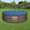 An above-ground swimming pool is set up on a green lawn, surrounded by trees and bushes. Náhľad obrázku produktu