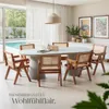 A dining room setting with a table and chairs, overlooking a swimming pool. Produktbild-Vorschau