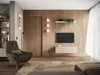 A modern living room with a TV mounted on a wooden wall, a lowboard underneath, and a comfortable armchair. Produktbild-Vorschau