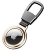 A close-up studio shot of a golden Apple AirTag case with a carabiner clip. Produktbild-Vorschau