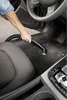 A person is vacuuming the floor of a car. Náhled obrázku produktu